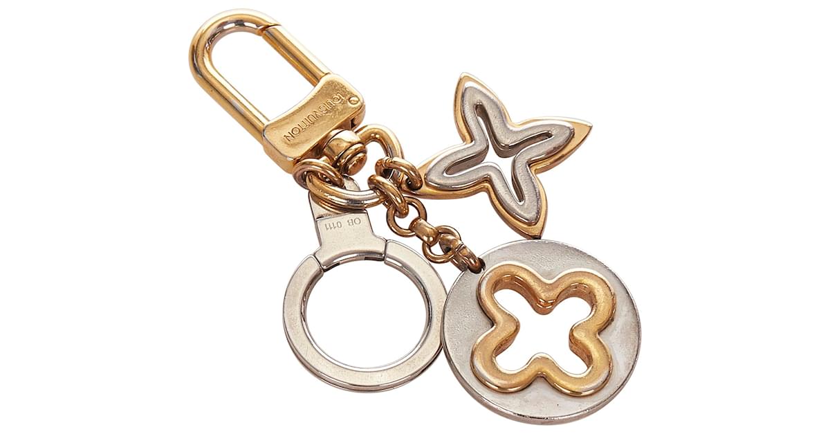 Louis Vuitton Gold Porte Cles Insolence Key Chain Silvery Golden Metal  ref.337937 - Joli Closet