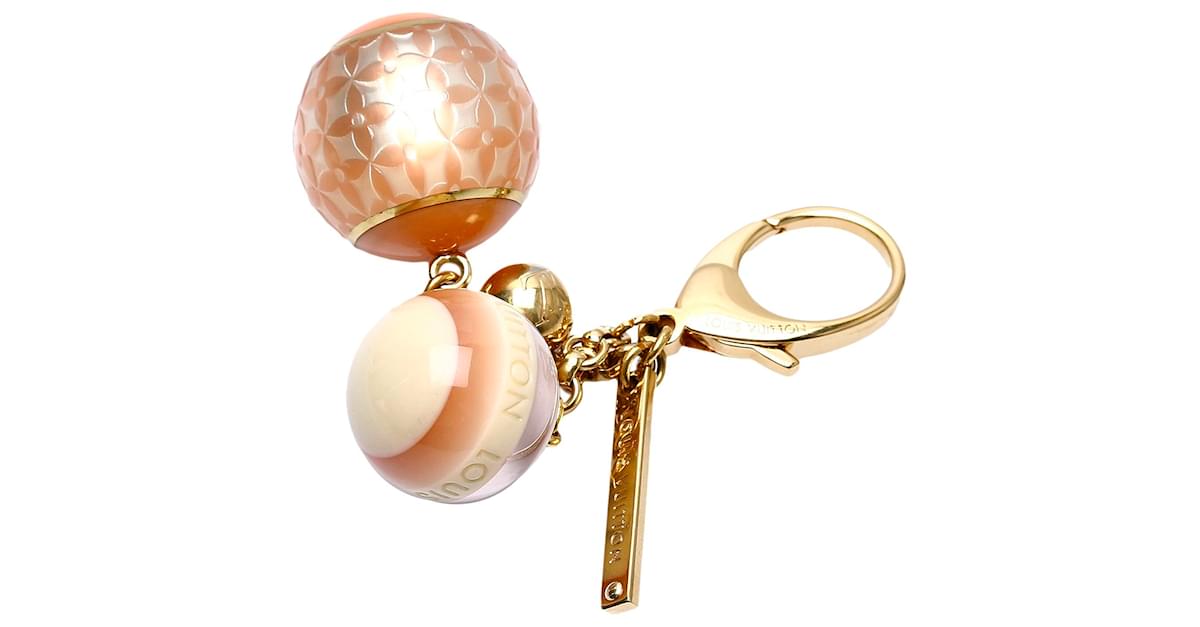 Louis Vuitton Brown Resin Ball Bag Charm Golden Metal Plastic ref.454411 -  Joli Closet