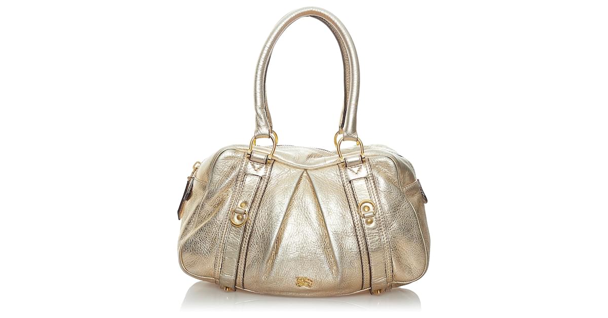 gold burberry purse