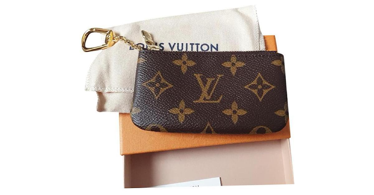 Braune Louis Vuitton Geldbörse aus beschichtetem Segeltuch Leinwand  ref.668625 - Joli Closet