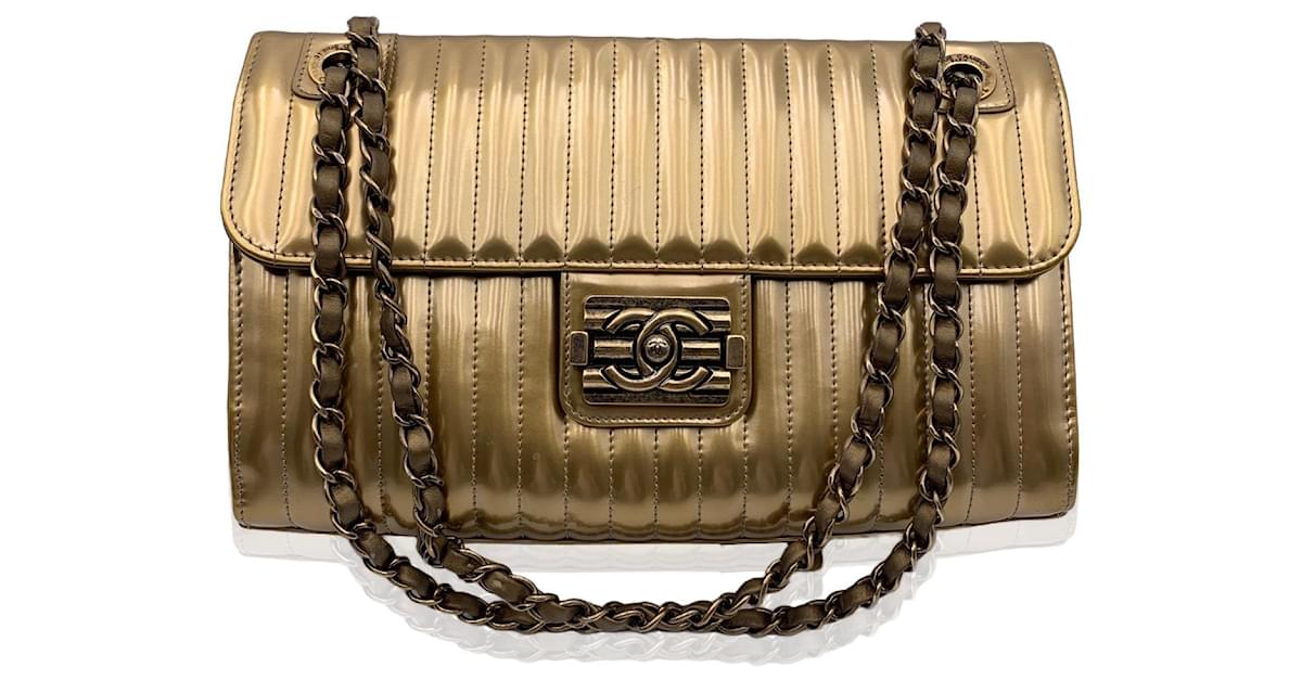 Chanel Boy Quilted Flap Bag in Metallic Patent