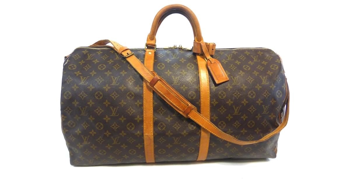 LOUIS VUITTON, PARIS. Keepall shoulder strap model 60. M…