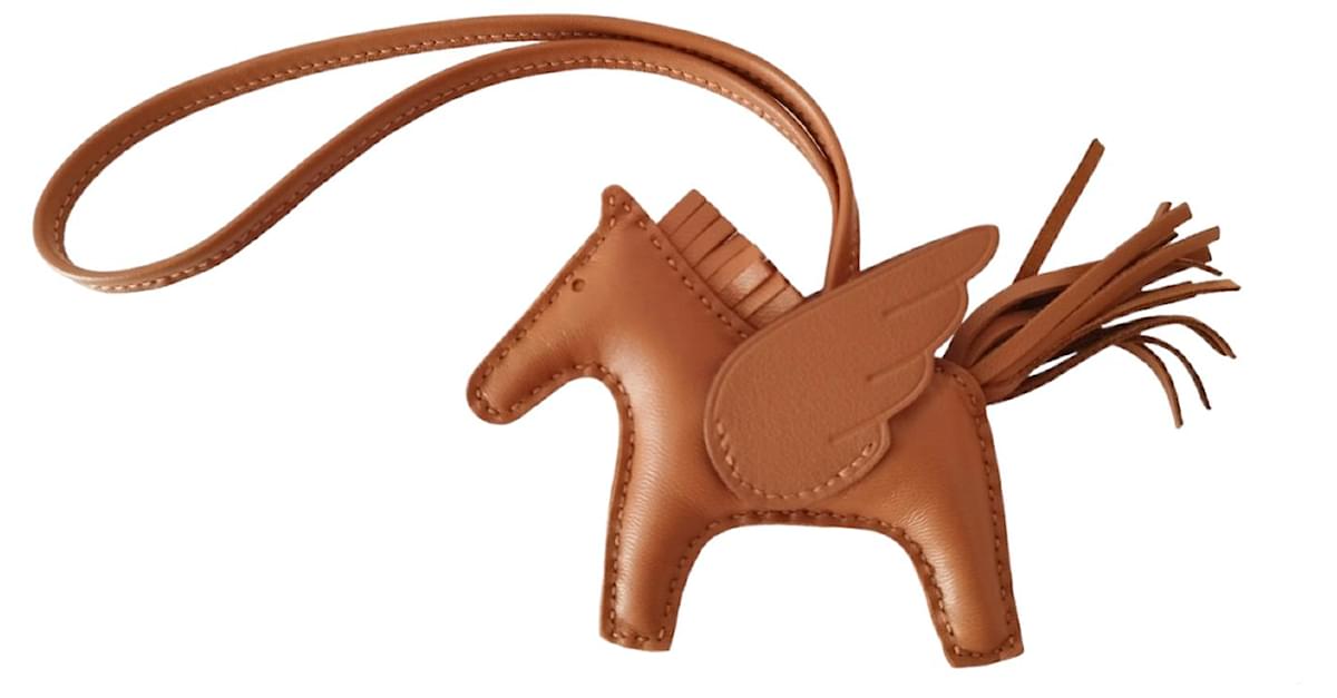 Rodéo pégase leather bag charm Hermès Gold in Leather - 18574231