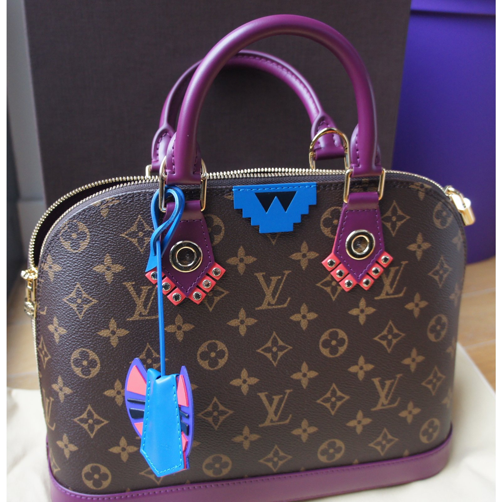 Louis Vuitton Alma Monogram Totem BB Flamingo in Canvas/Leather