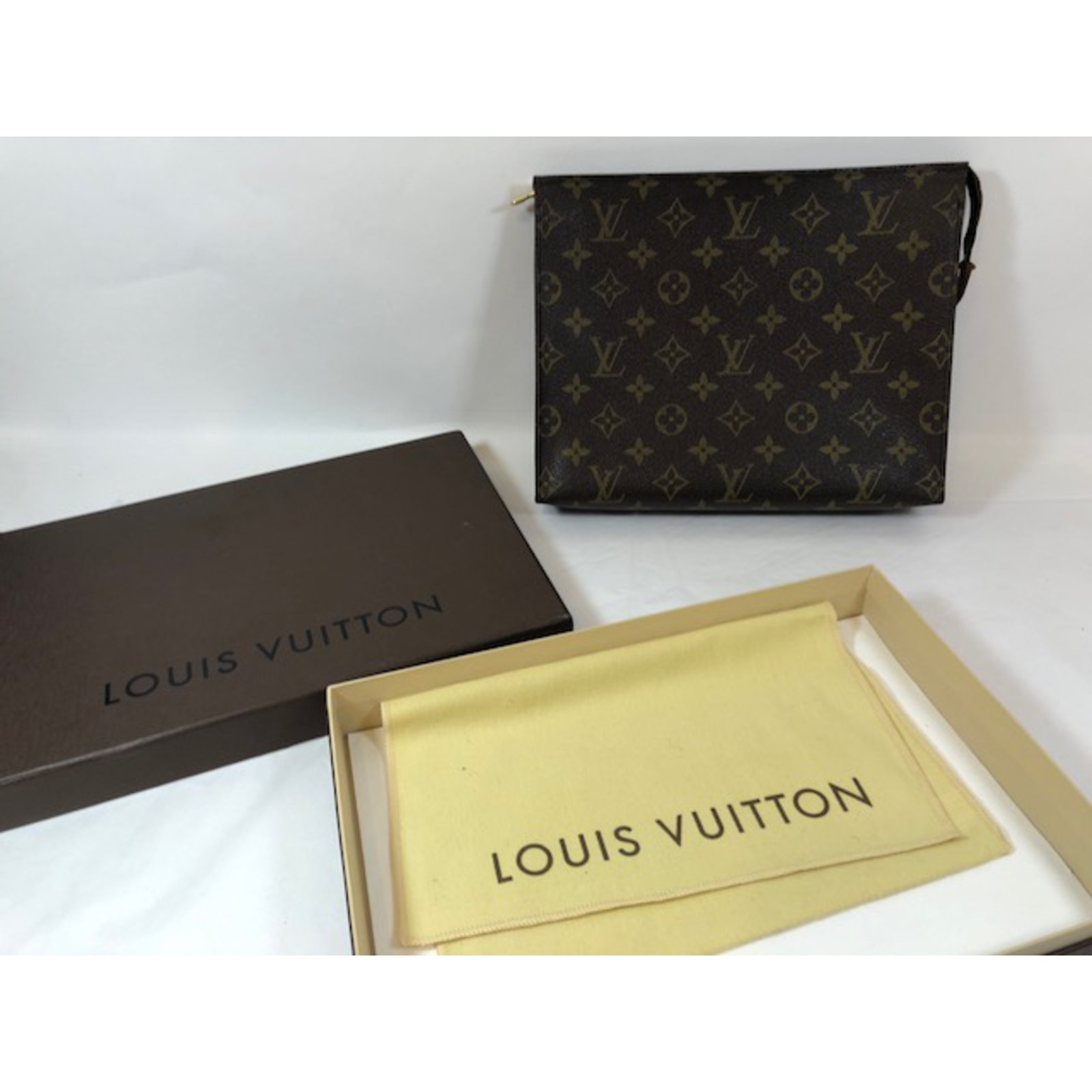 Leather clutch bag Louis Vuitton Brown in Leather - 31322036