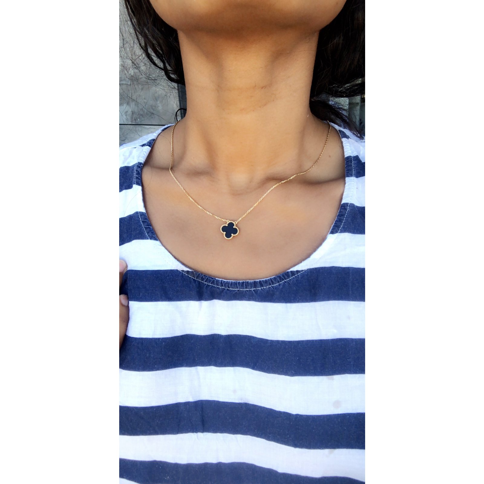 van cleef necklace on neck