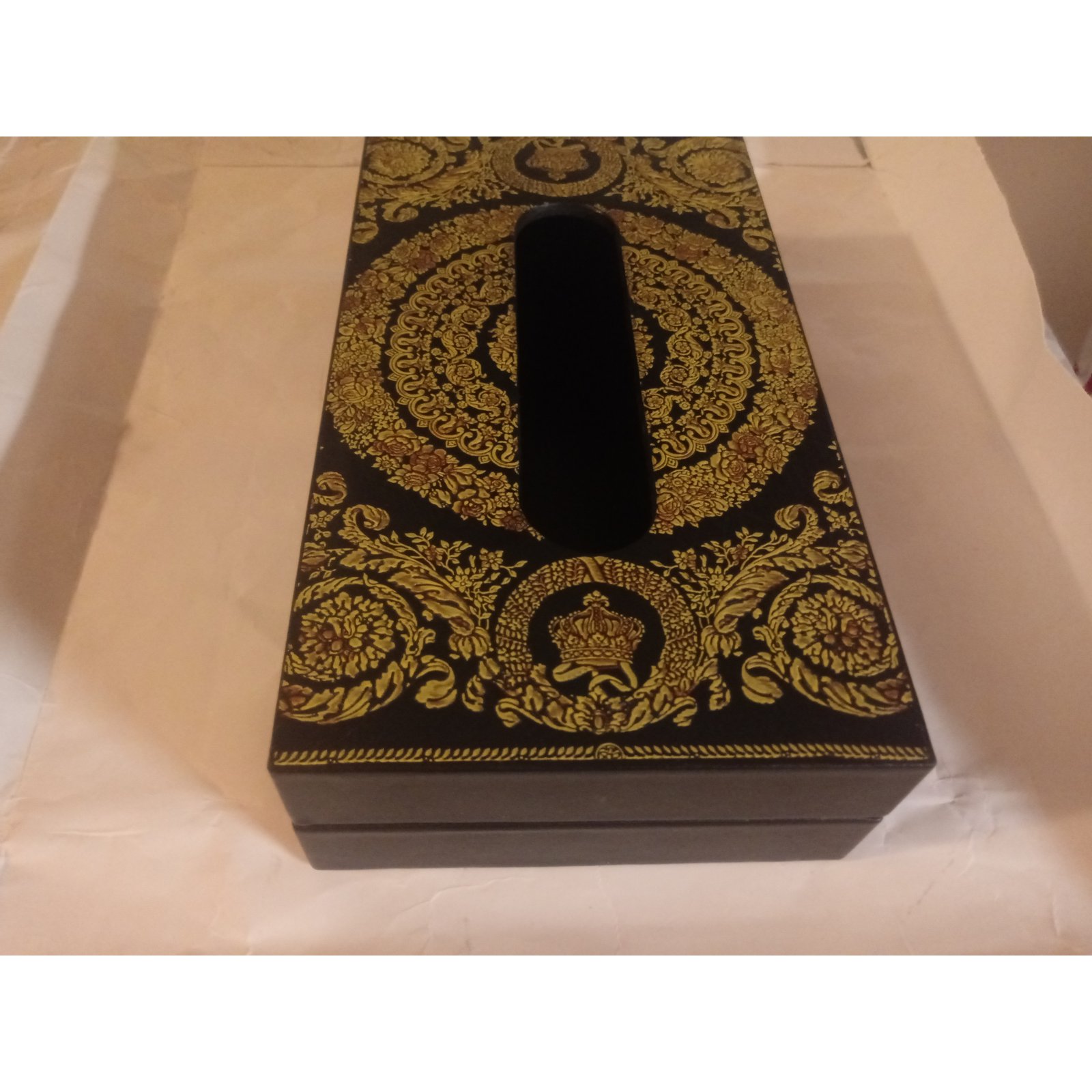 Golden Versace pataren on black box. Tissue box template concept