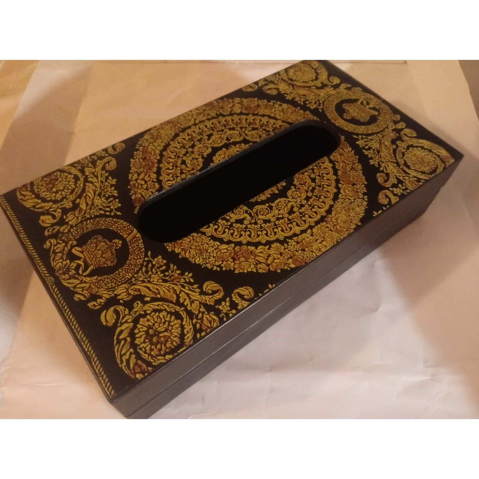 Golden Versace pataren on black box. Tissue box template concept