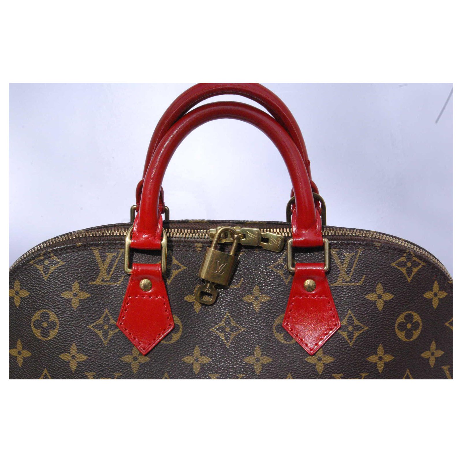 Louis Vuitton Alma PM Brown Red Leather Cloth ref.118709 - Joli Closet