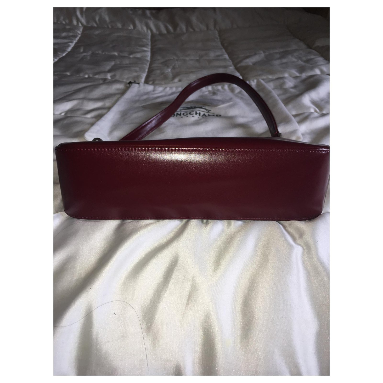 Vintage Longchamp bag, Fuseau model, cowhide leather in dark fuchsia /  burgundy tones