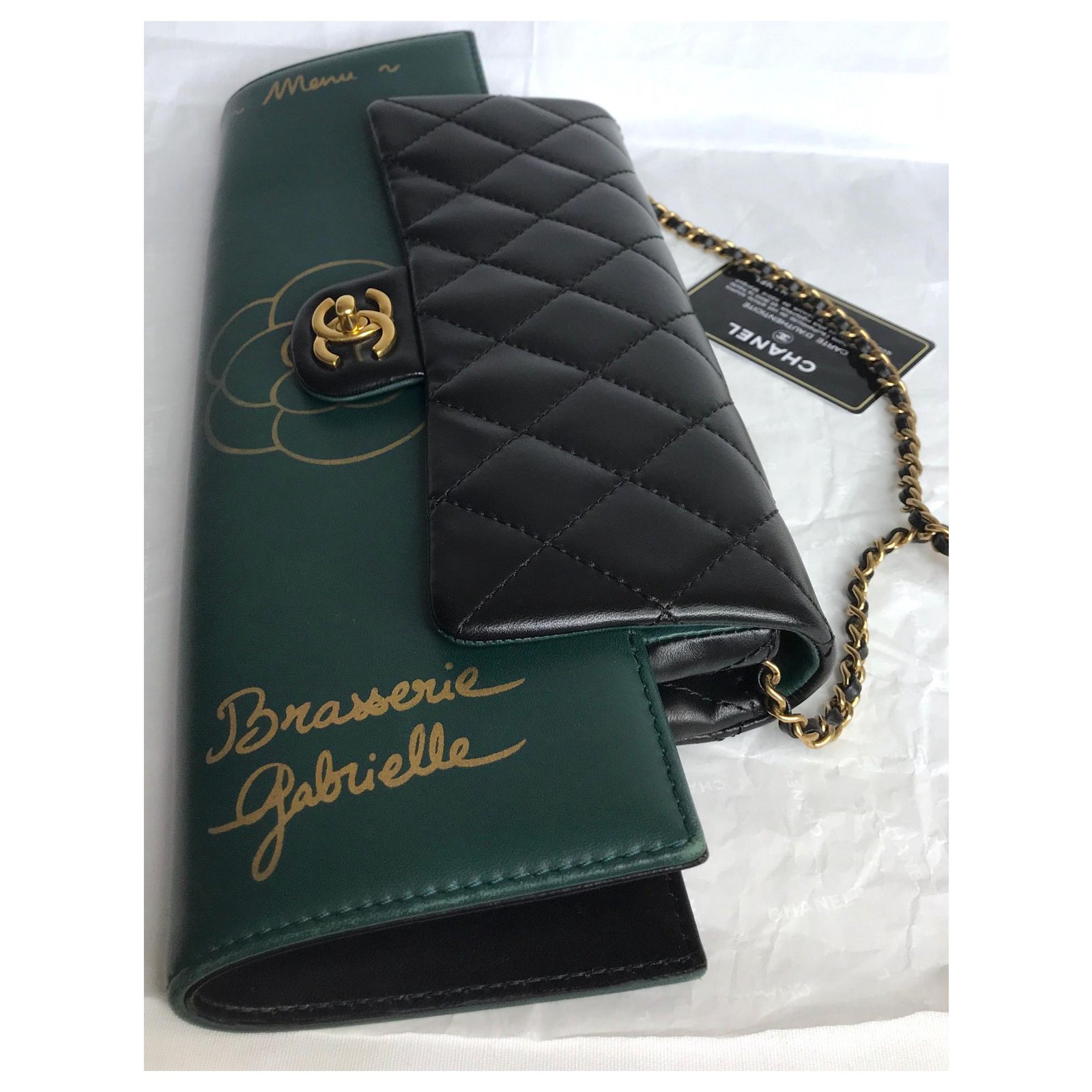 New Condition- Chanel Clutch in black patent quilted leather, Champagne  hardware