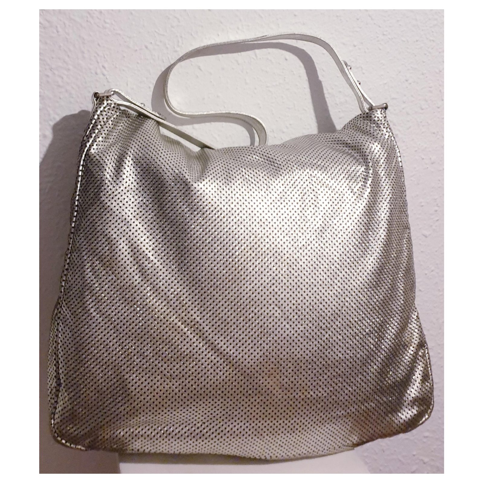 Chanel Metallic Silver Perforated Leather Large Rodeo Drive Hobo at 1stDibs