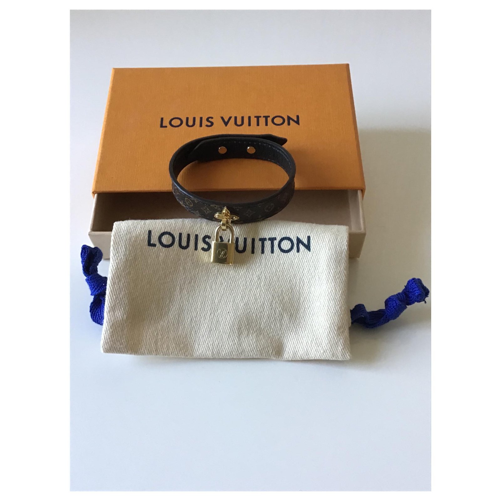 Superb new Louis Vuitton bracelet with padlock Brown Cloth ref.184845 -  Joli Closet