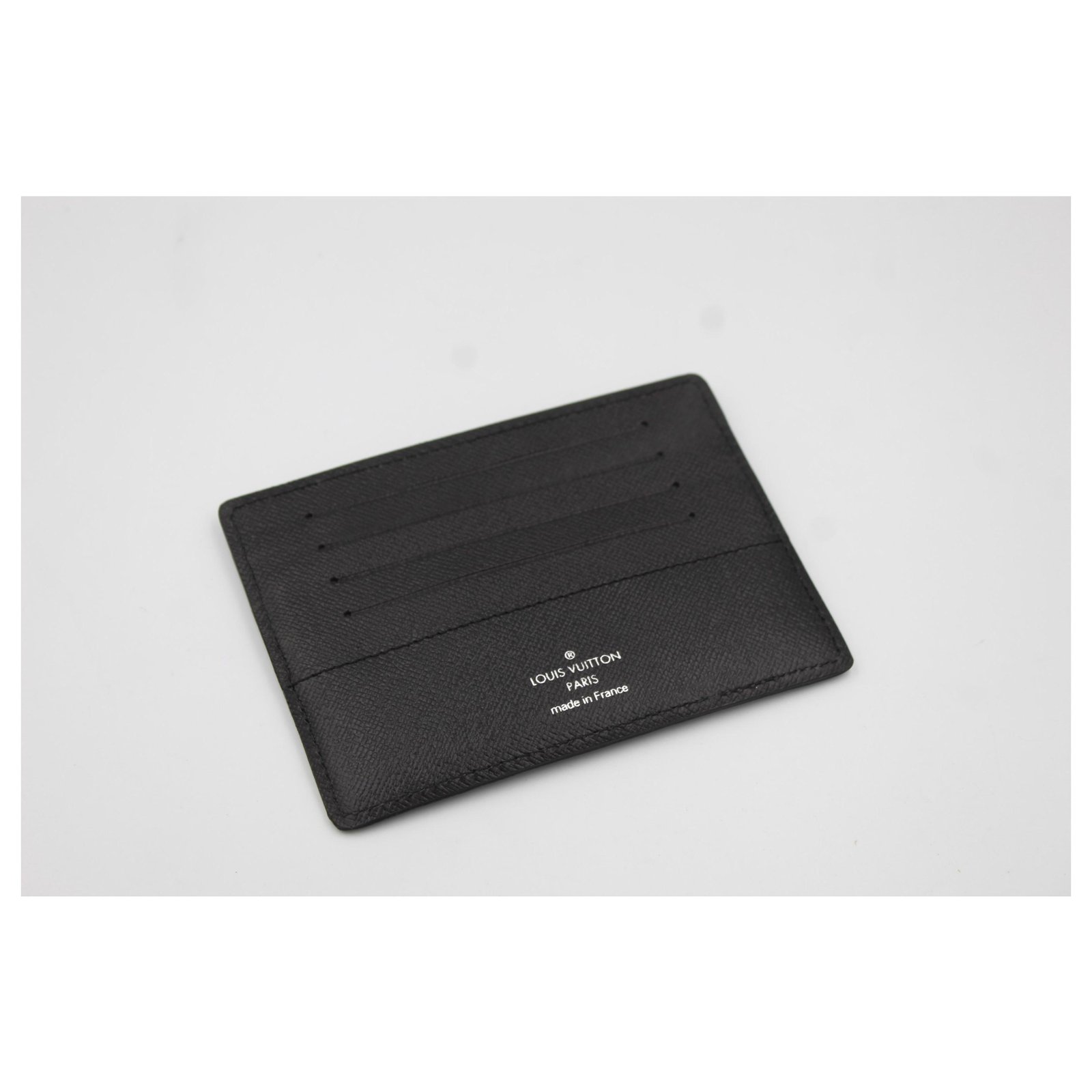 Louis Vuitton card holder in damier monogram.