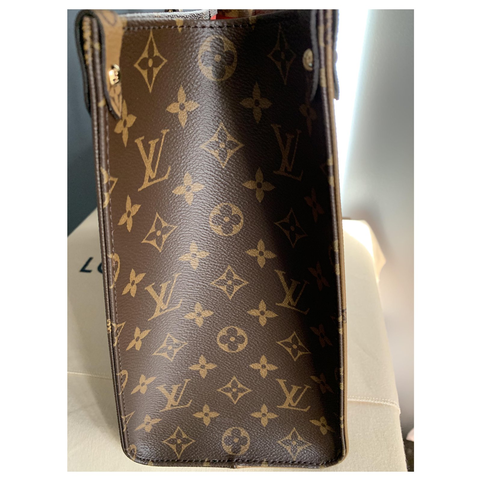 Onthego cloth handbag Louis Vuitton Brown in Cloth - 34602572
