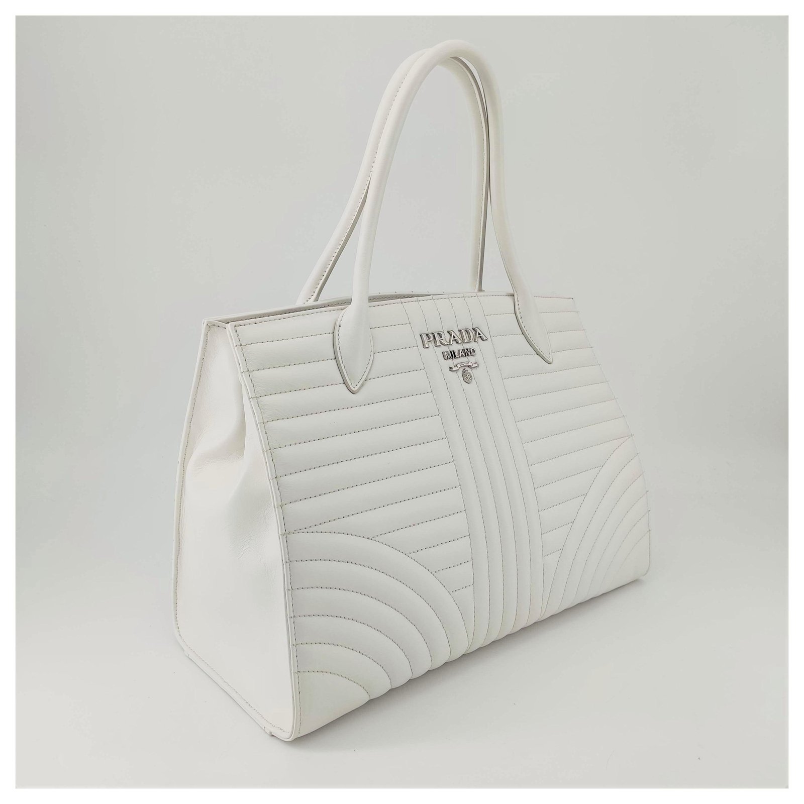 Prada, Diagramme shoulder bag in white leather  - Joli Closet