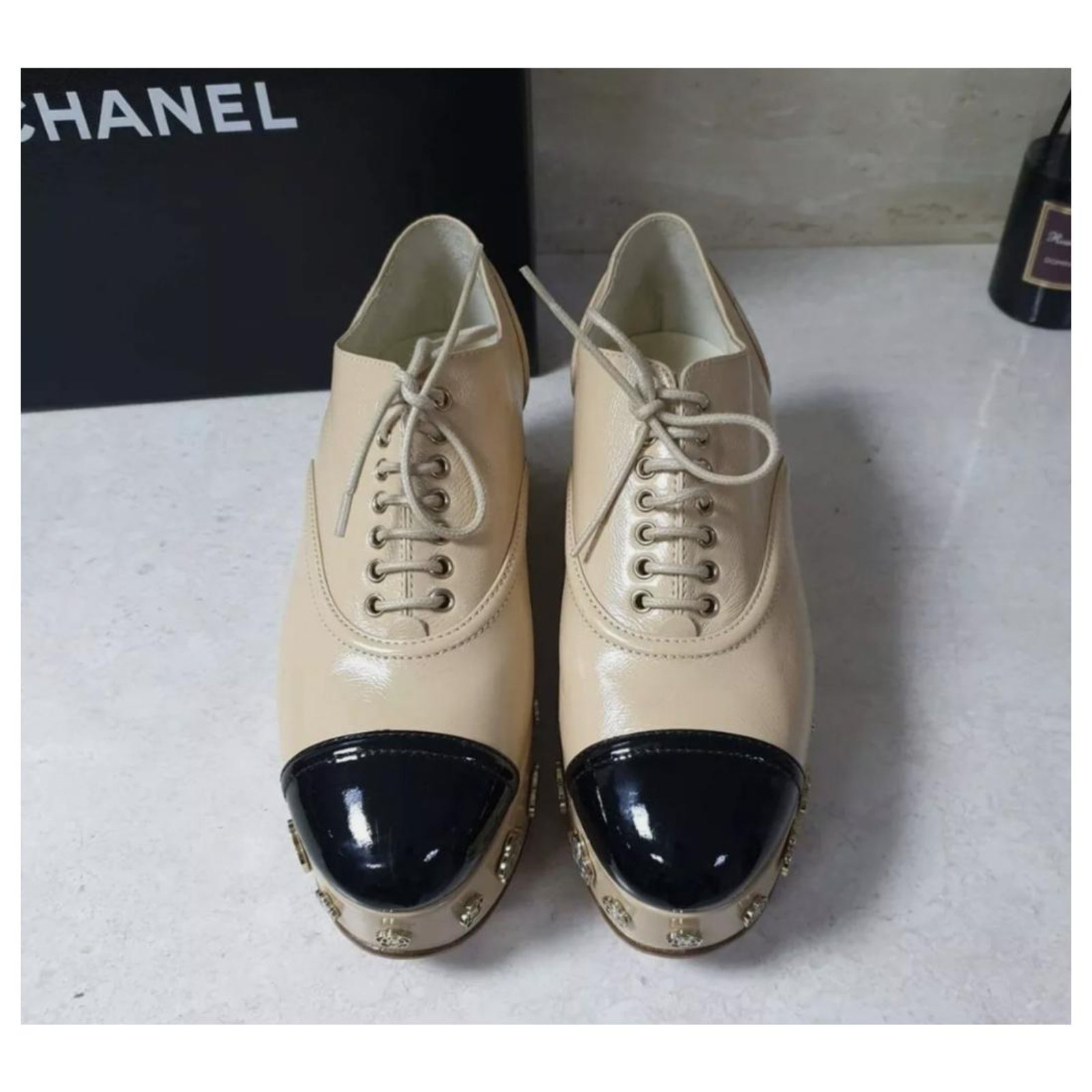Chanel Black Beige Leather Metal Camellia Wedge Shoes Patent leather  ref.280184 - Joli Closet