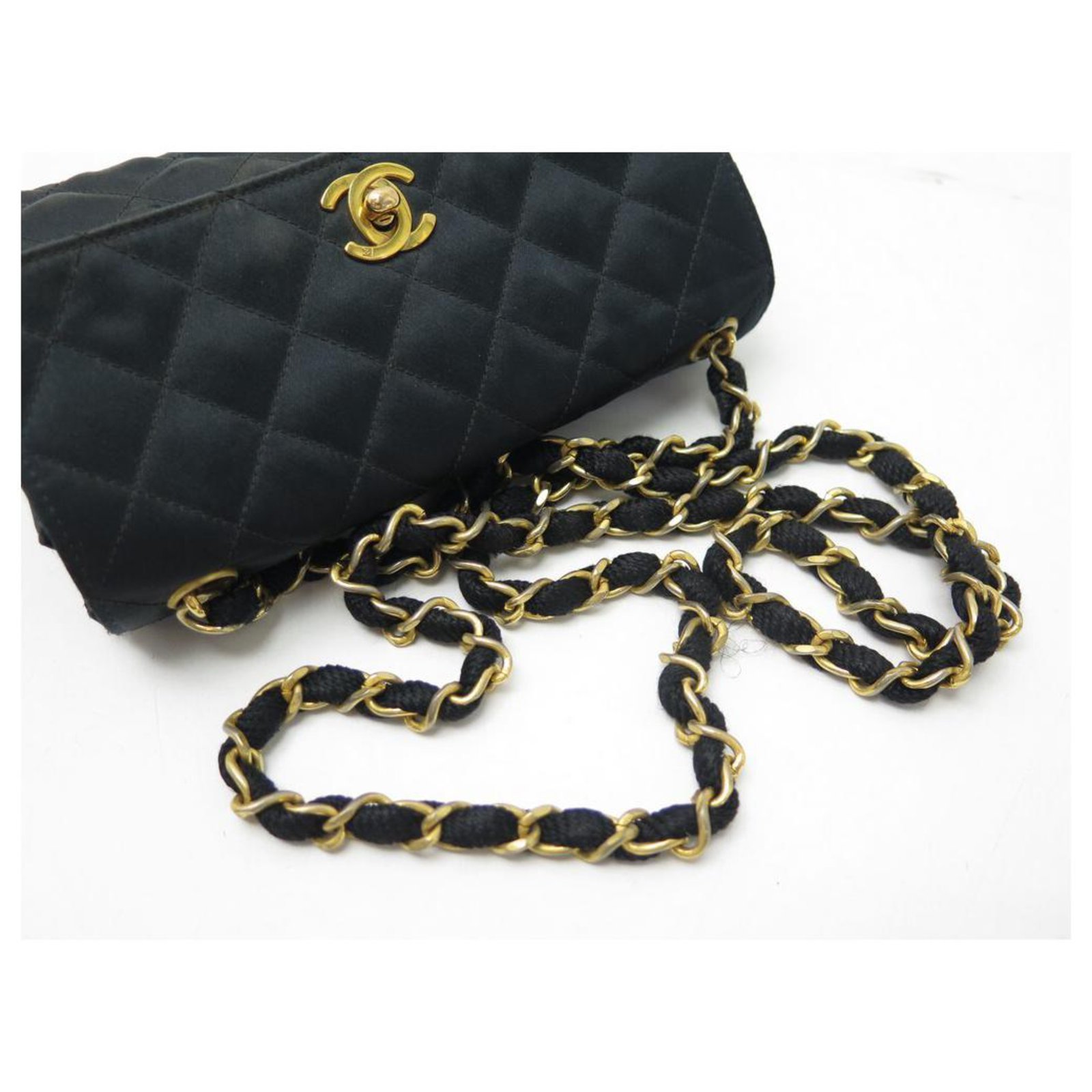 VINTAGE CHANEL MINI TIMELESS HANDBAG IN SATIN QUILTED BANDOULIERE HAND BAG  Black Cloth ref.328904 - Joli Closet