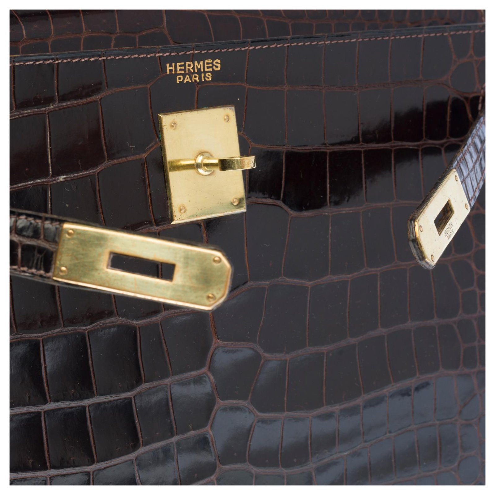 HERMES. 32cm Kelly bag in brown porosus crocodile, gold-…