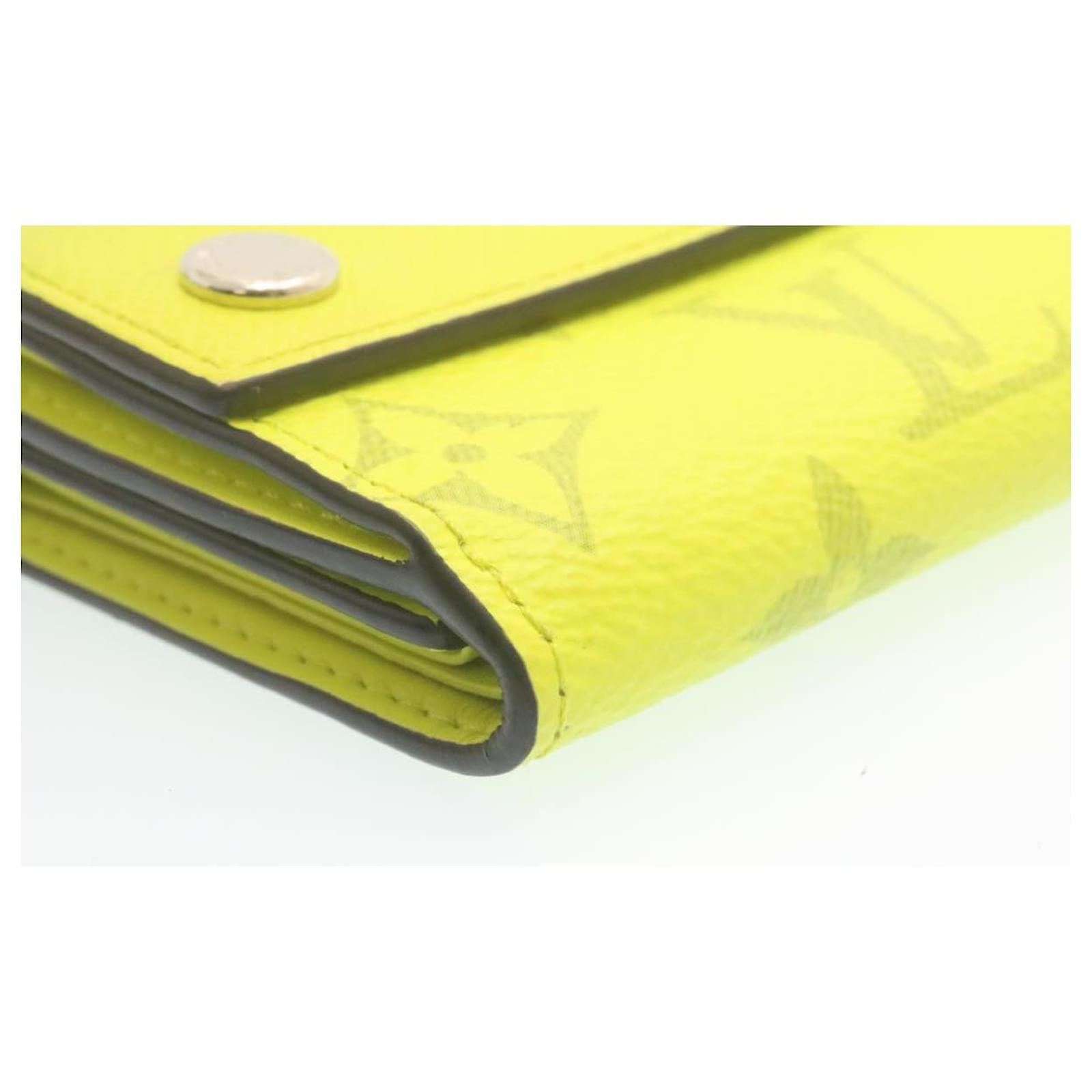 LOUIS VUITTON Monogram Taiga Discovery Compact Wallet Yellow 1232482