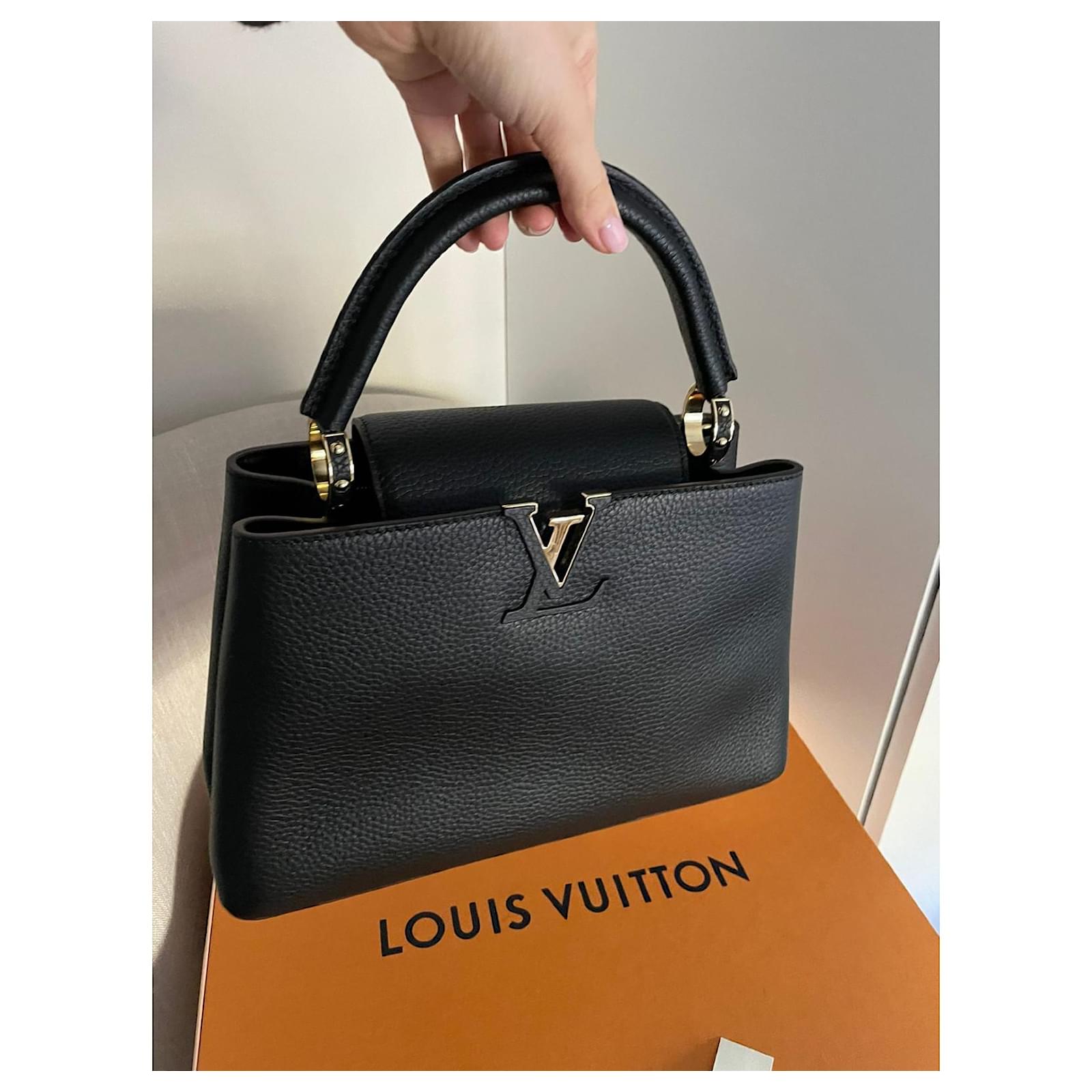 LOUIS VUITTON Capucines model. Handbag in black grained…