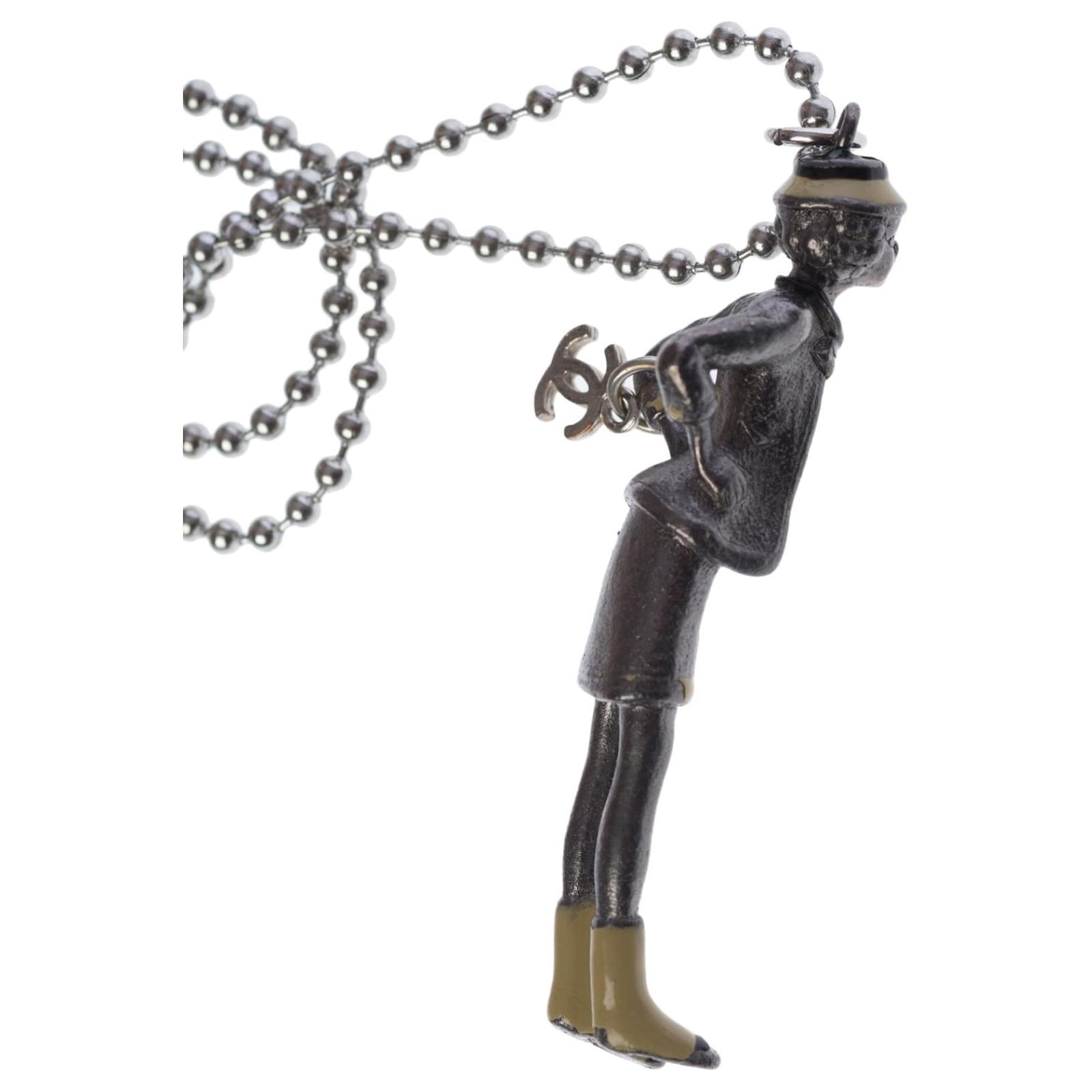 Collector necklace representing the Coco Chanel doll in silver metal  Silvery Steel ref.454316 - Joli Closet