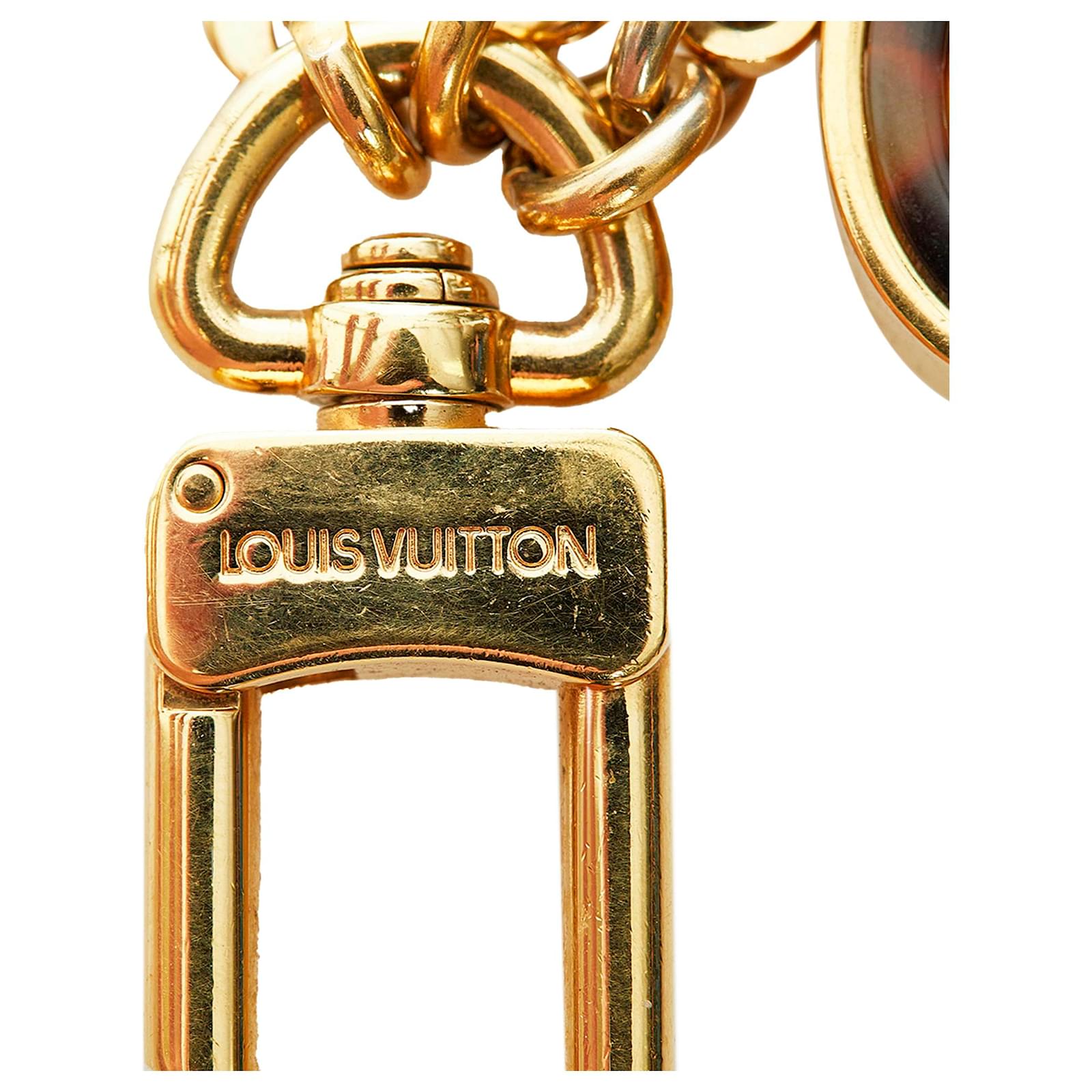 LOUIS VUITTON Charm keychain in golden metal. Cm 18x4. L…