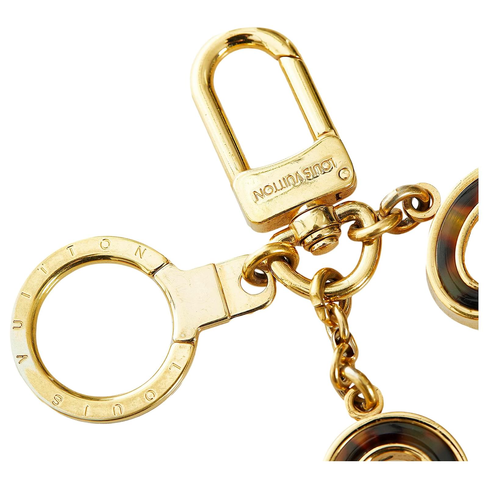 Louis Vuitton Gold Lock and Key Bag Charm Golden Metal ref.473435 - Joli  Closet