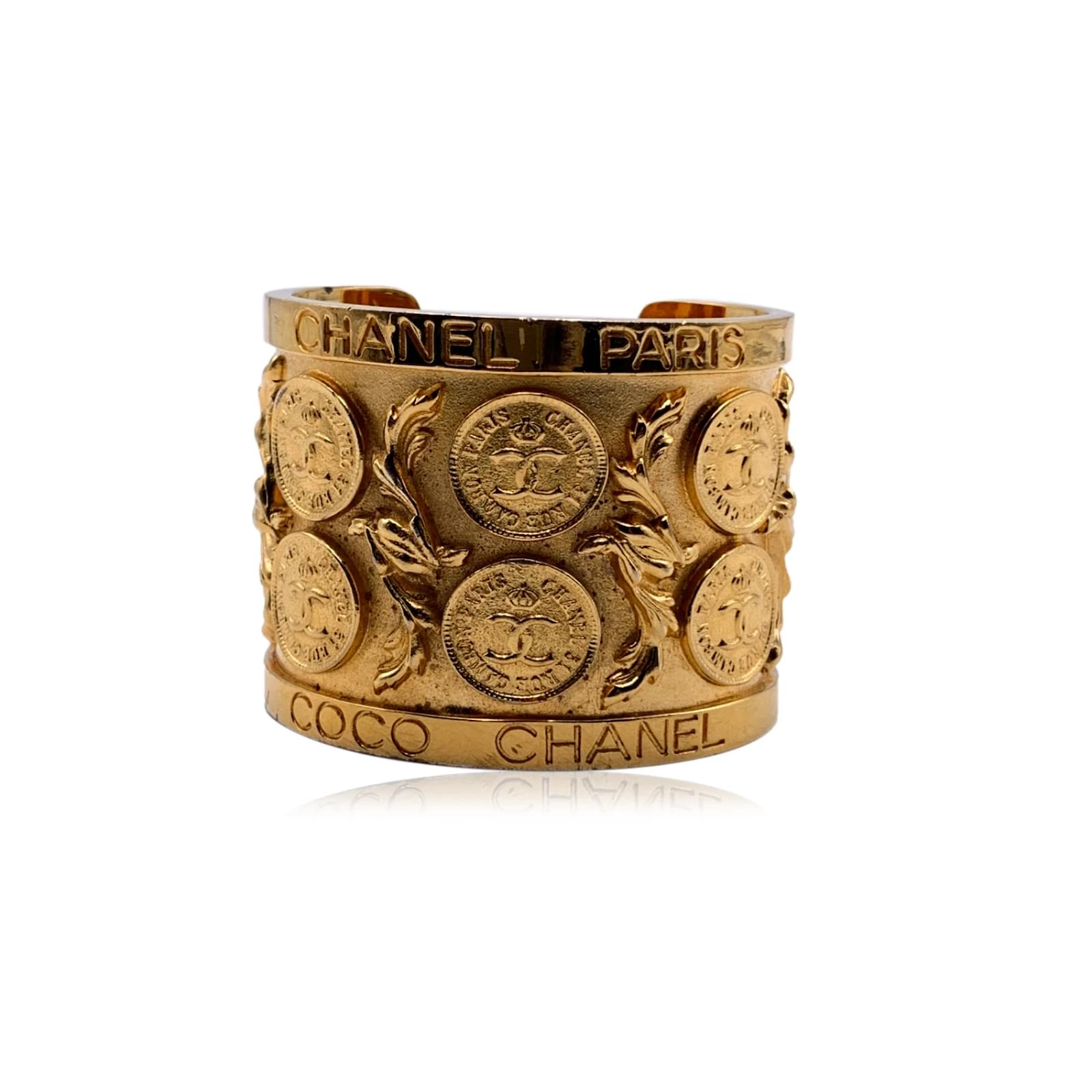 Chanel Vintage Rare Gold Metal Coin CC Logos Cuff Bangle Bracelet Golden  ref.499764 - Joli Closet