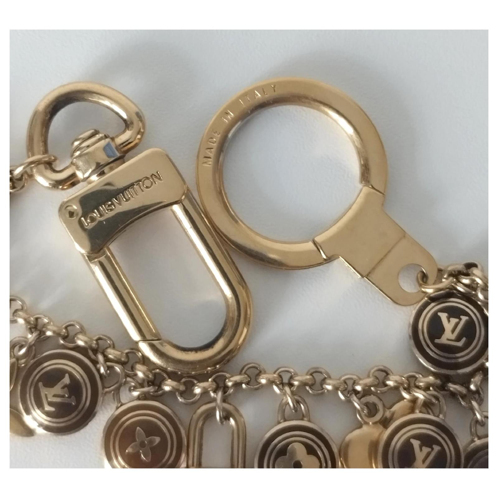 Leather bag charm Louis Vuitton Gold in Leather - 27825438