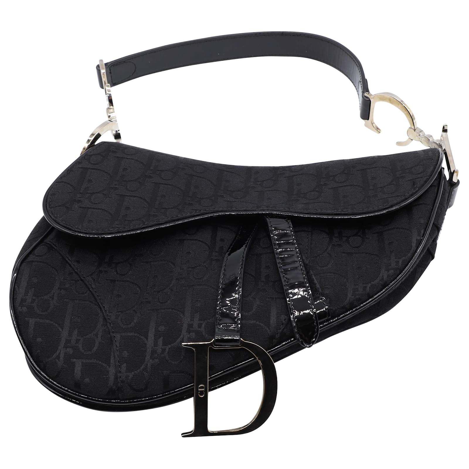 A vintage Christian Dior Saddle bag made of monogrammed fabric and  decorated with golden letters Leather darkblue handle and fastening  straps One interi  Сумки