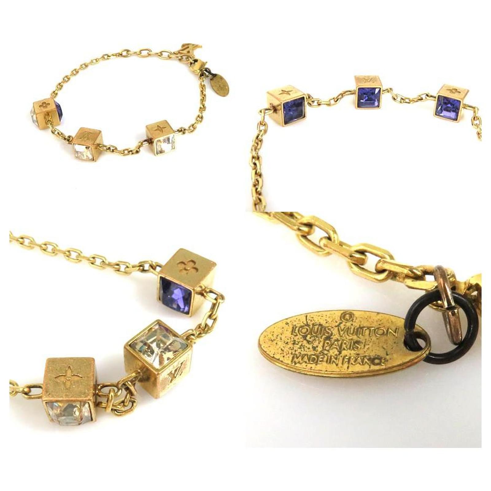 Altri gioielli Louis Vuitton, bracciale in resina con logo oro D'oro  ref.1002653 - Joli Closet