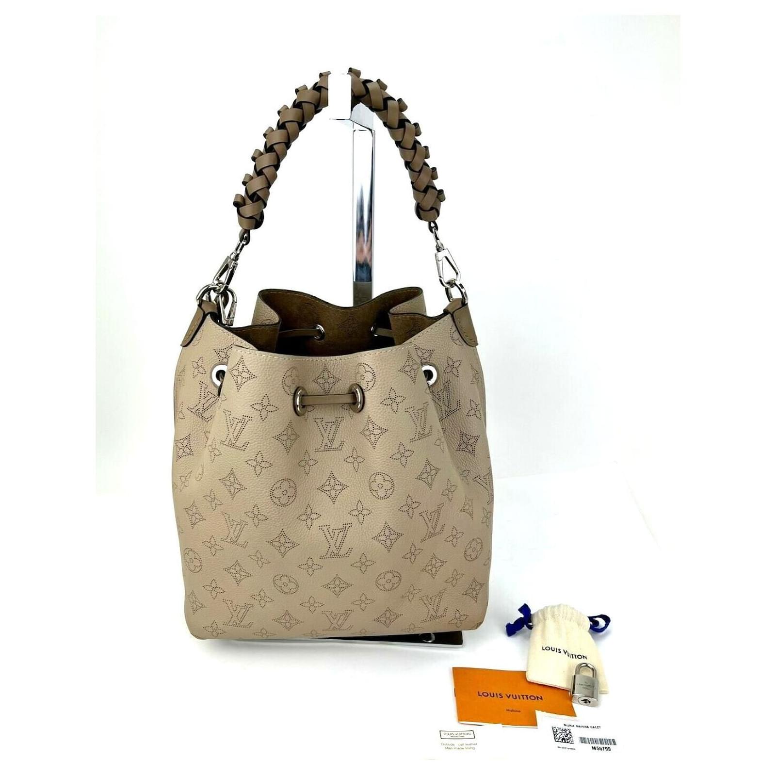 Louis Vuitton Handbag Muria Mahina Perforated Calfskin Leather Galet Gray  Bagc68 Pony-style calfskin ref.641193 - Joli Closet