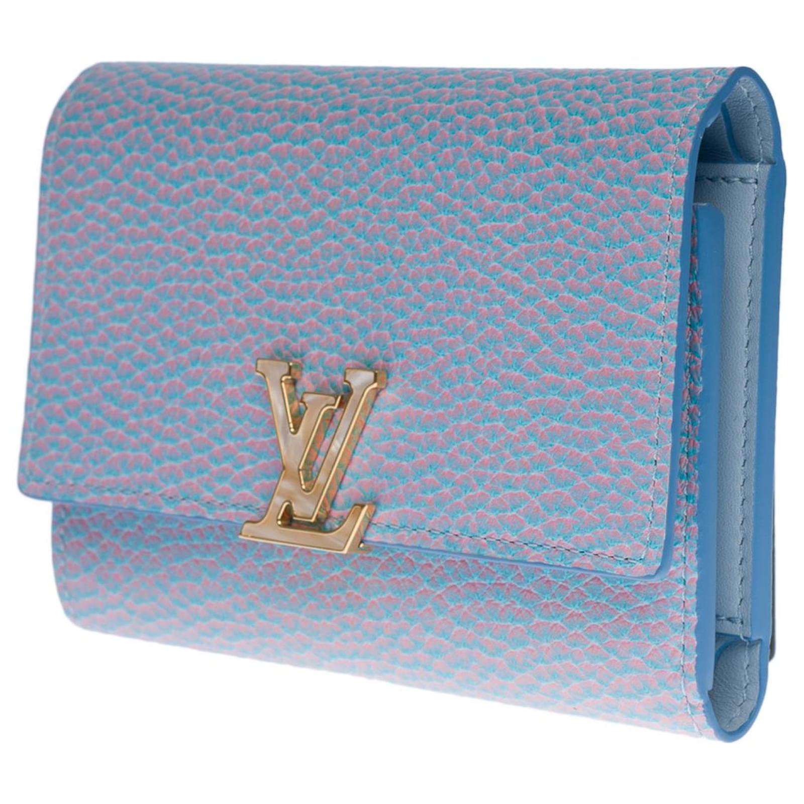 Beautiful Louis Vuitton Capucines wallet with blue and lilac reflection