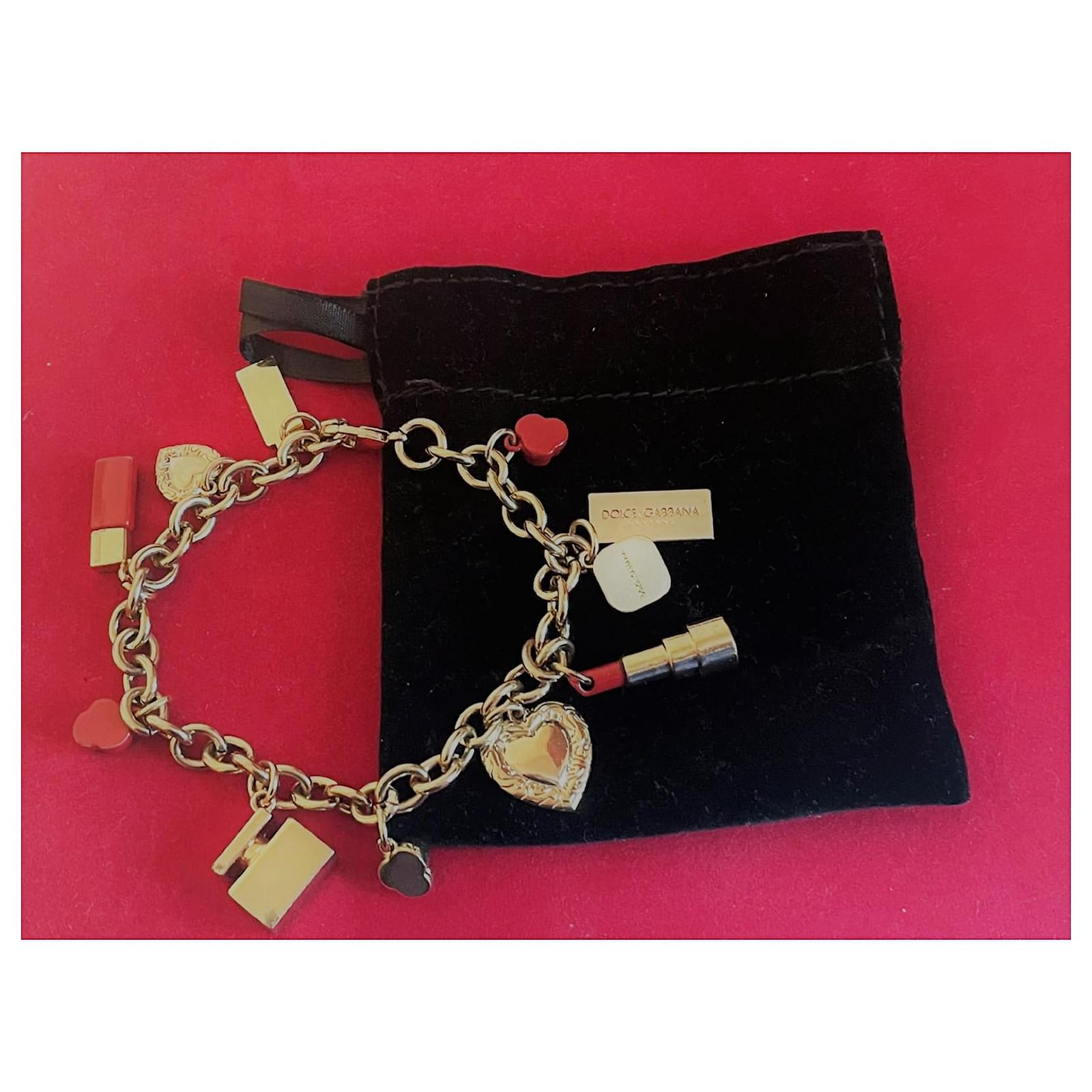 Dolce & Gabbana golden steel bracelet with lipstick charms  -  Joli Closet