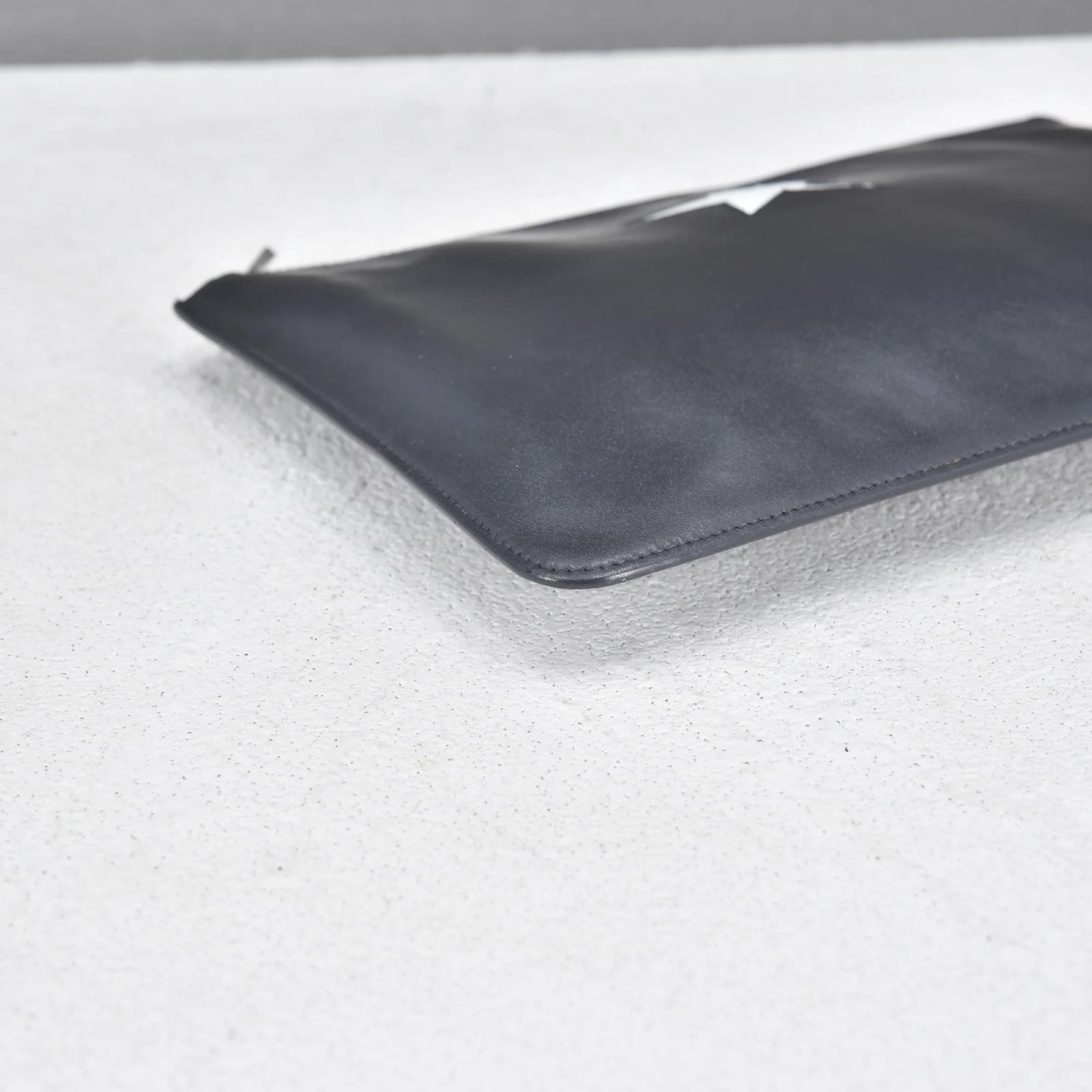 Givenchy Leather Star Embossed Clutch Black Pony-style calfskin