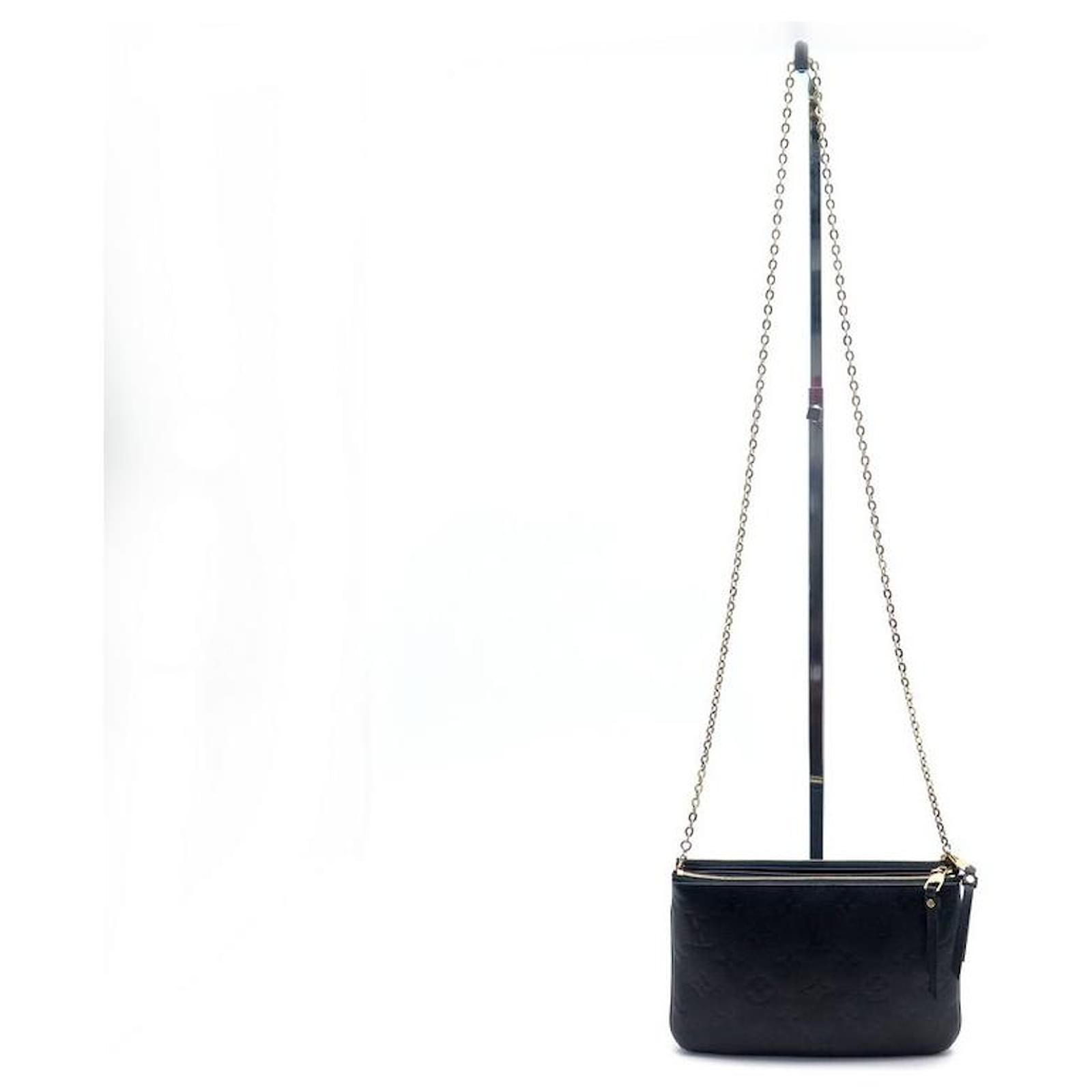 Pochette Double Zip en cuir monogram empreinte - Louis Vuitton