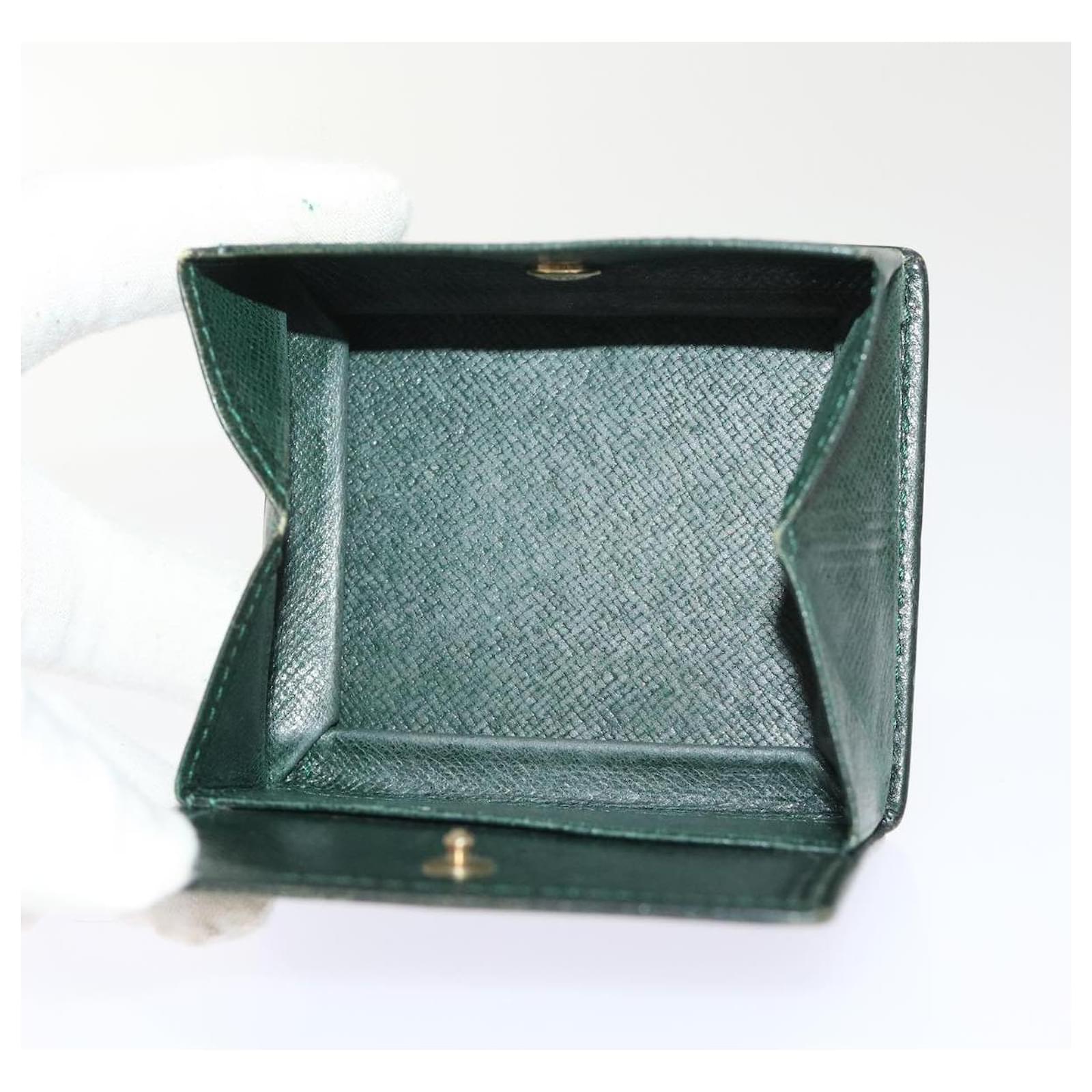 Louis Vuitton offers taiga leather pouch in chains forest green