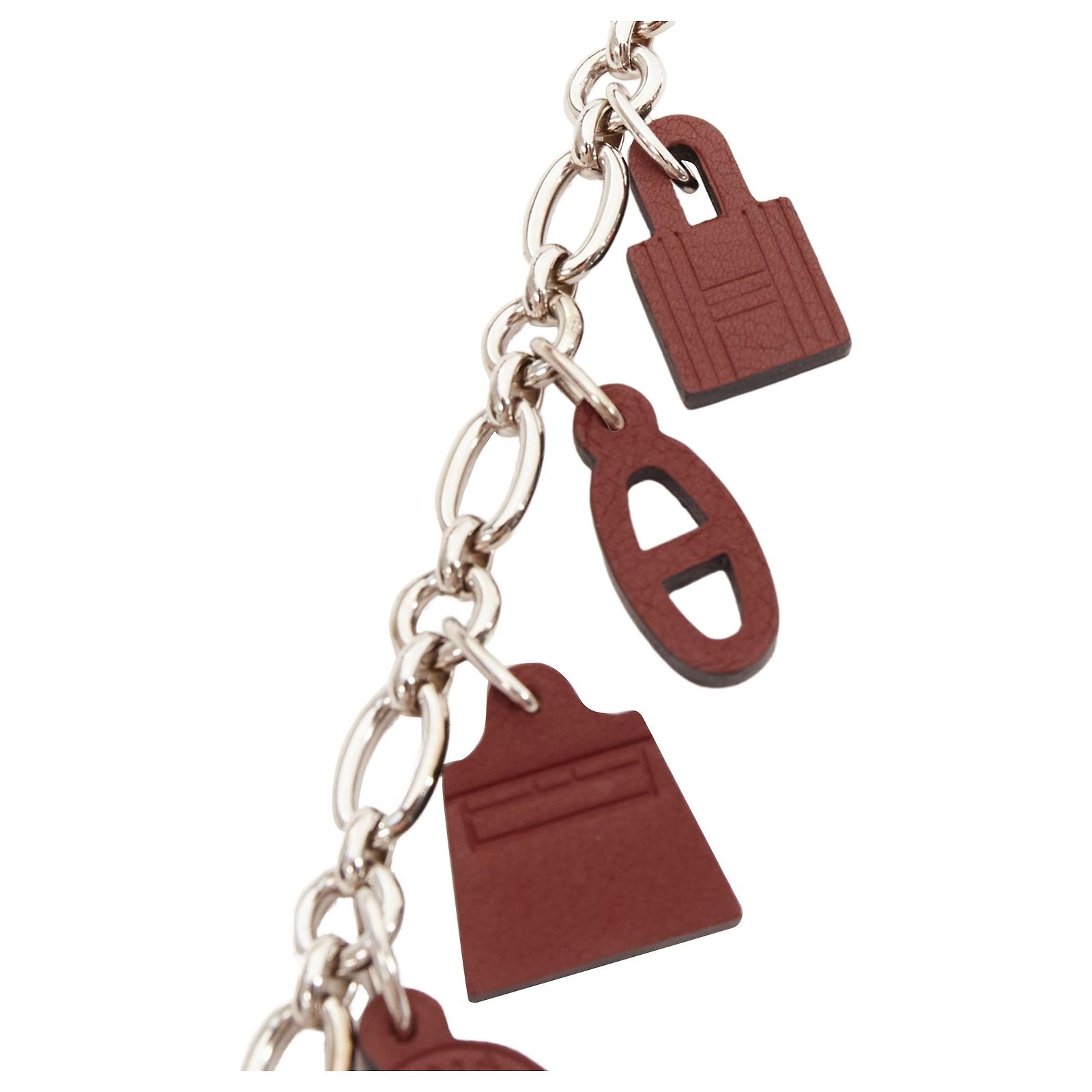 Breloque Sac / Amulette HERMES D'occasion - Argenté Et Cuir Noir - Très Bon état