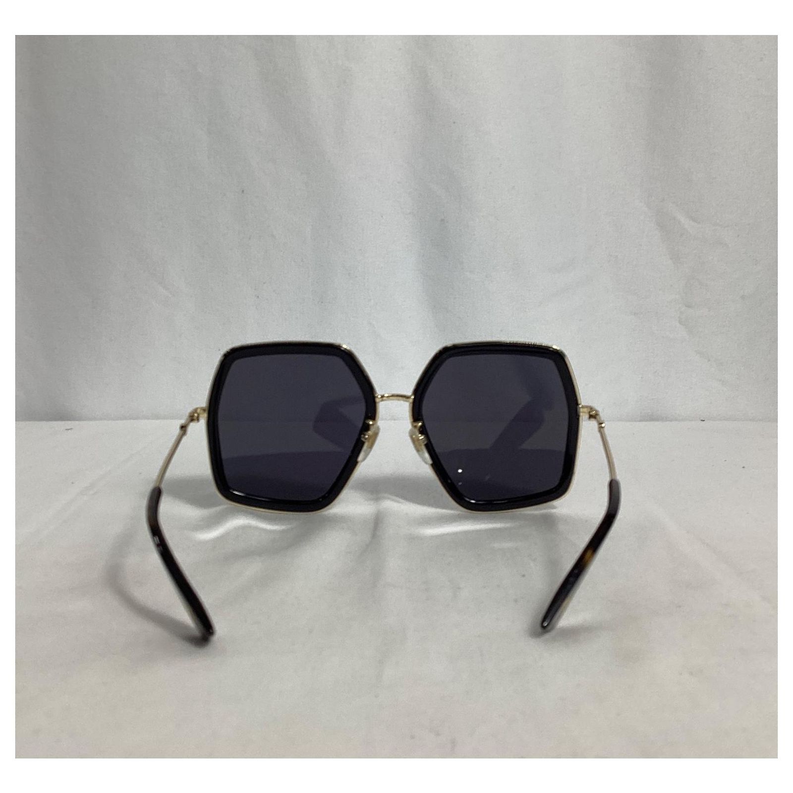 Gucci GG0106S 001 Oversized Sunglasses in Black and Gold 