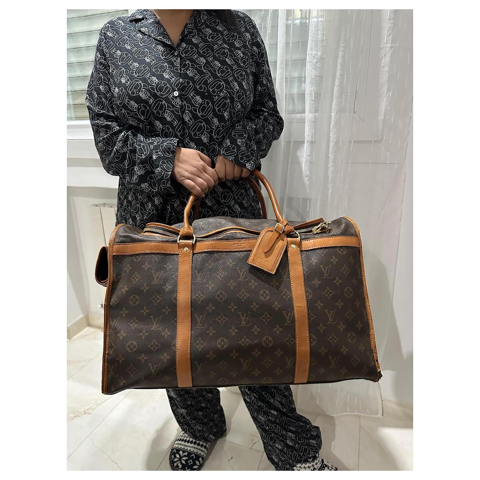Keepall Louis Vuitton dog bag Brown Cloth  ref.2001867