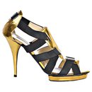 Sandálias de couro preto e dourado com bandagem - Oscar de la Renta