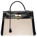 Stunning Hermes Kelly handbag 35 inverted cm in black box leather and beige canvas, garniture en métal doré - Hermès