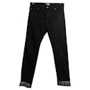 Jeans Kenzo com virada preta e branca da marca