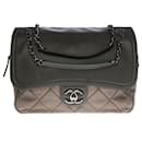 The original and practical Chanel Classic Flap bag in gray semi-quilted leather, antique silver metal trim