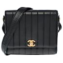 Lovely & Very Rare Chanel Mini Classic Flap bag in black quilted leather with chevron stitching, garniture en métal doré