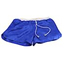 Pantalones cortos de satén con cinturilla blanca en seda azul de Balmain