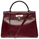 Magnificent Hermès Kelly handbag 32 turned shoulder strap in burgundy leather (Red H), gold plated metal trim