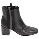 Ankle boot Brunello Cucinelli com listra de cashmere em couro preto
