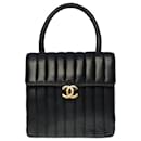 Lovely Chanel Classique flap bag Mini handbag in black quilted lambskin, vertical stitching, garniture en métal doré